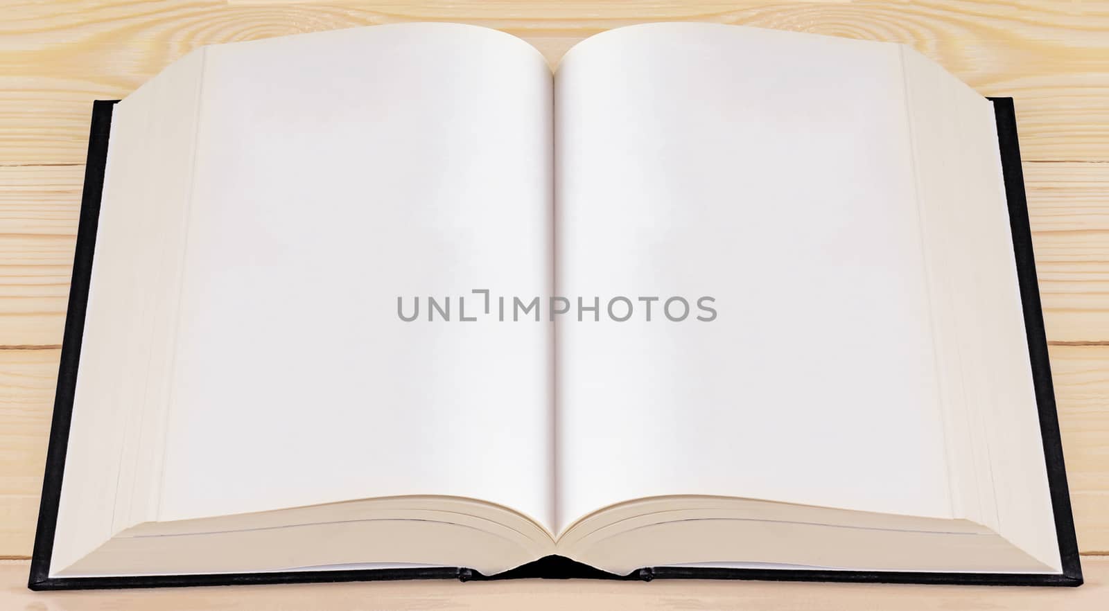 Book on wood background, education concept