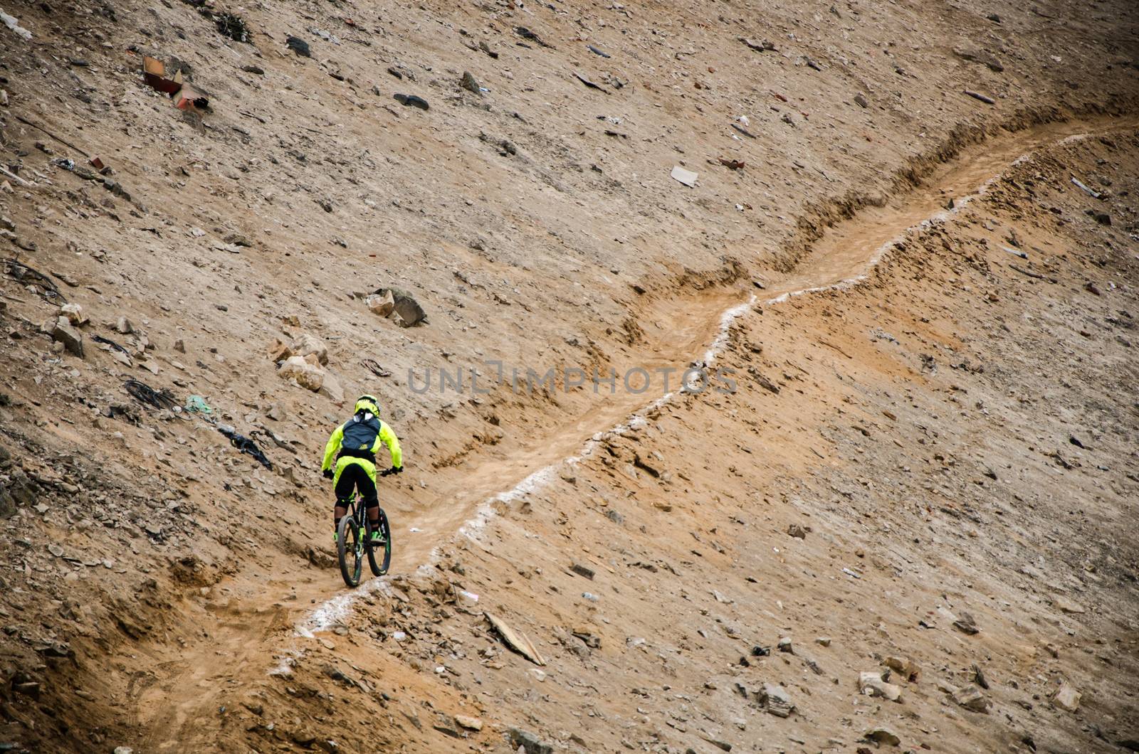 A cyclist practicing Downhill from the top of the Hill