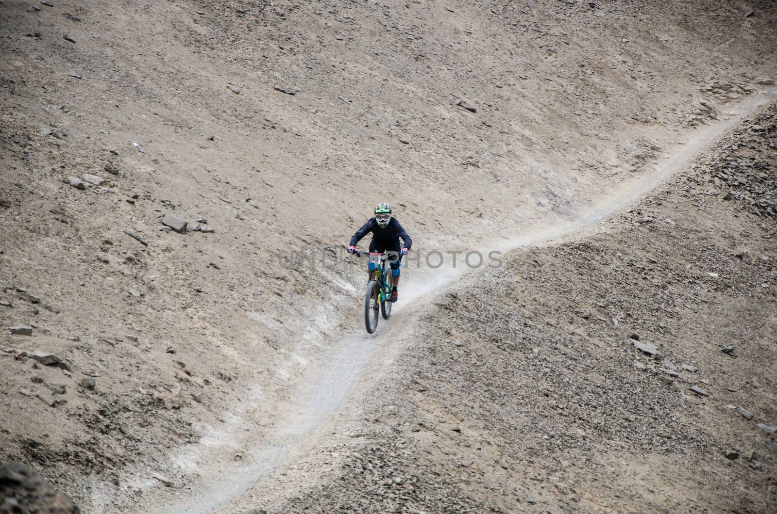 A cyclist practicing Downhill from the top of the Hill