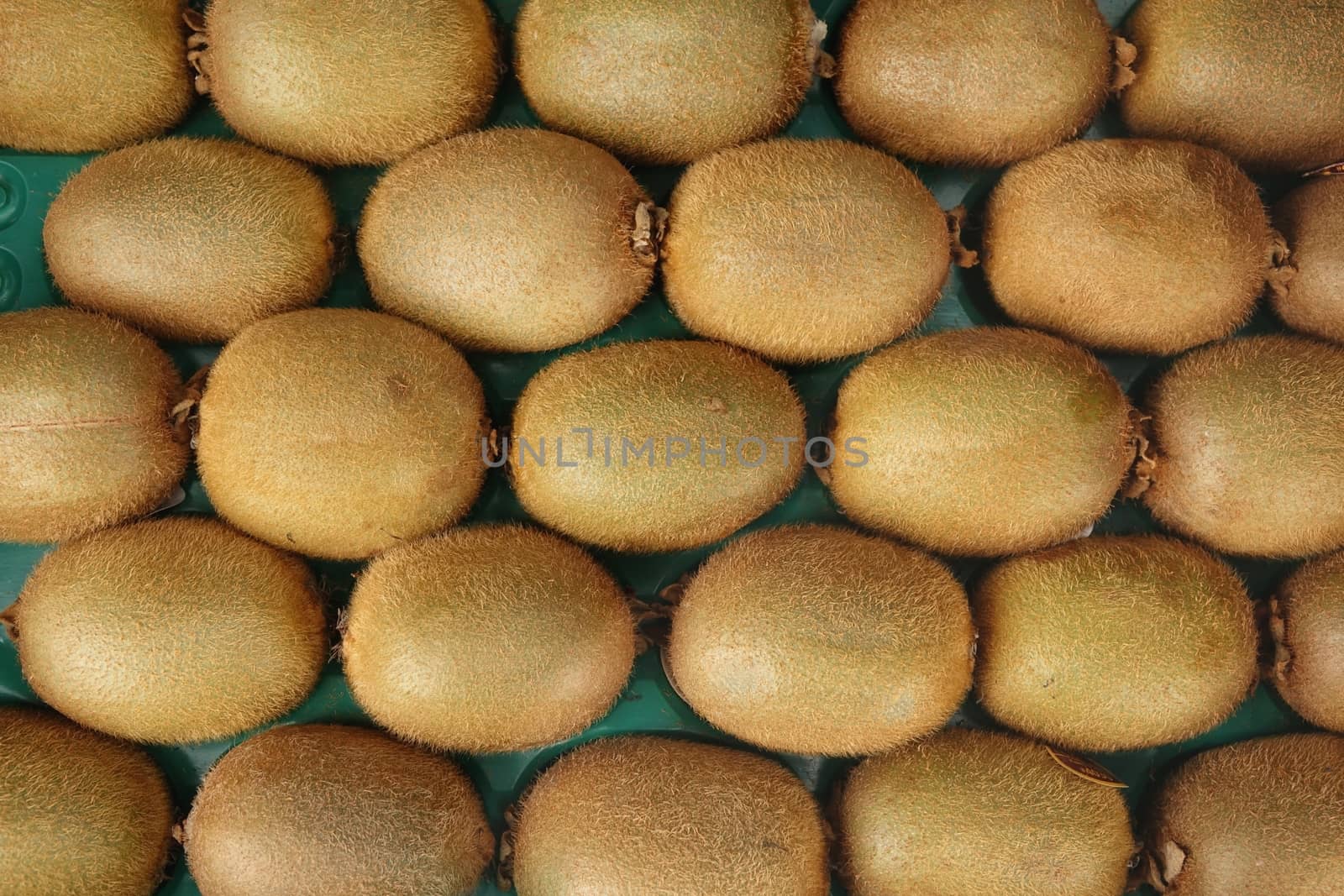 A box with kiwi or gooseberry fruits