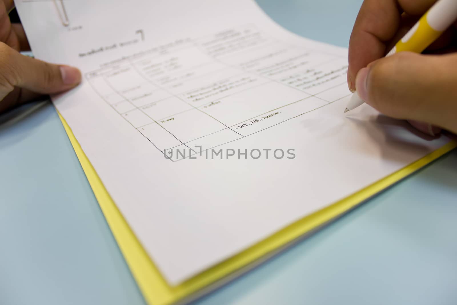 close up on a businessman hands signing a contract