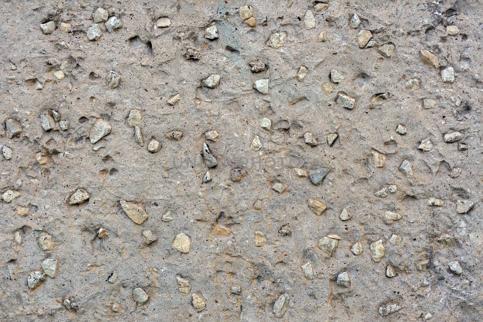 seamless flat concrete with rocks - grey texture and background.