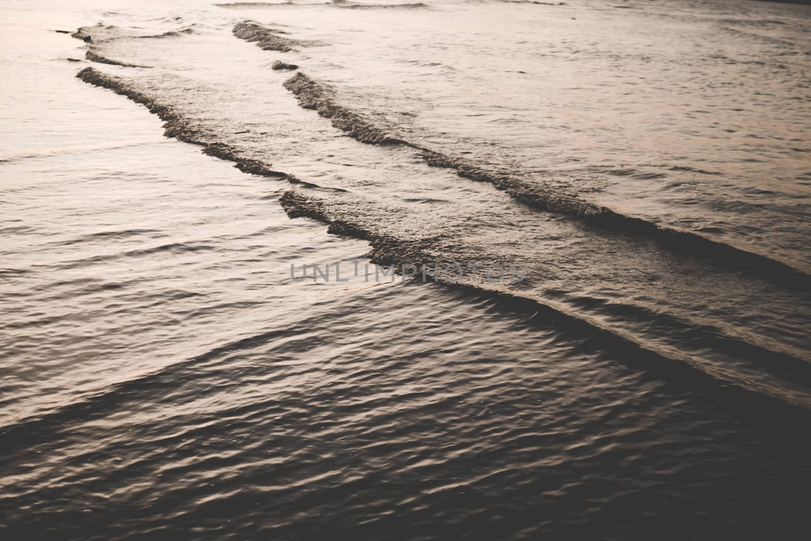 Tropical nature clean beach and white sand in summer season with dark color tone background. by Suwant