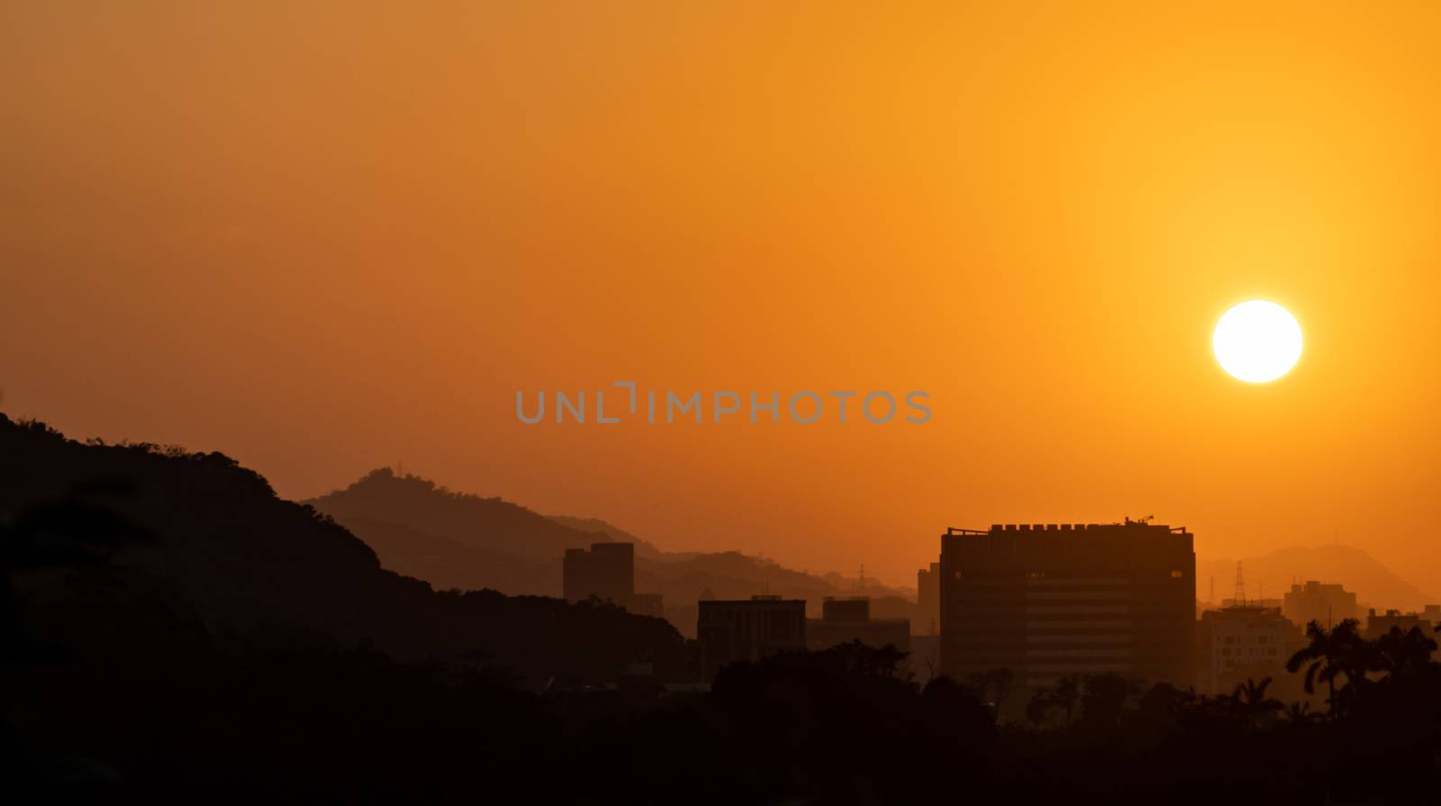 City Sky Sunset with building silhouette.