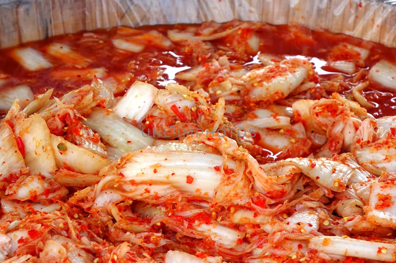 An outdoor vendor sells Kimchi, that is fermented spicy cabbage
