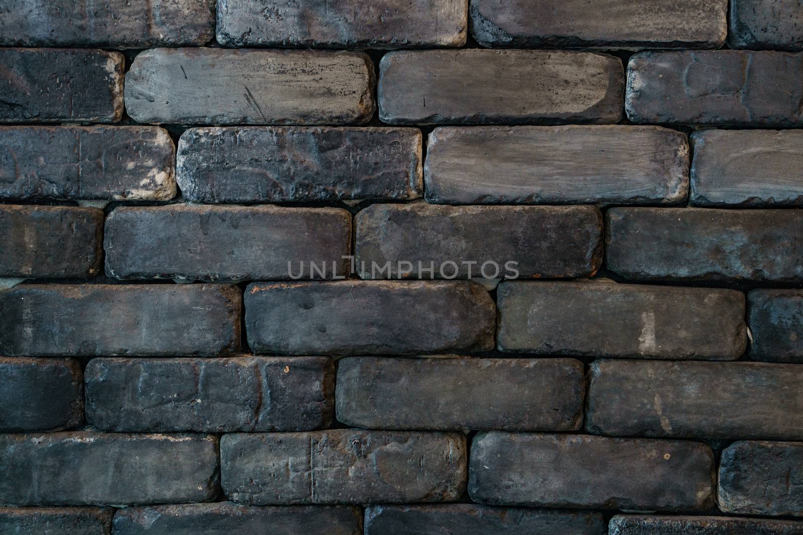 black brick wall texture, black brick wall surface.