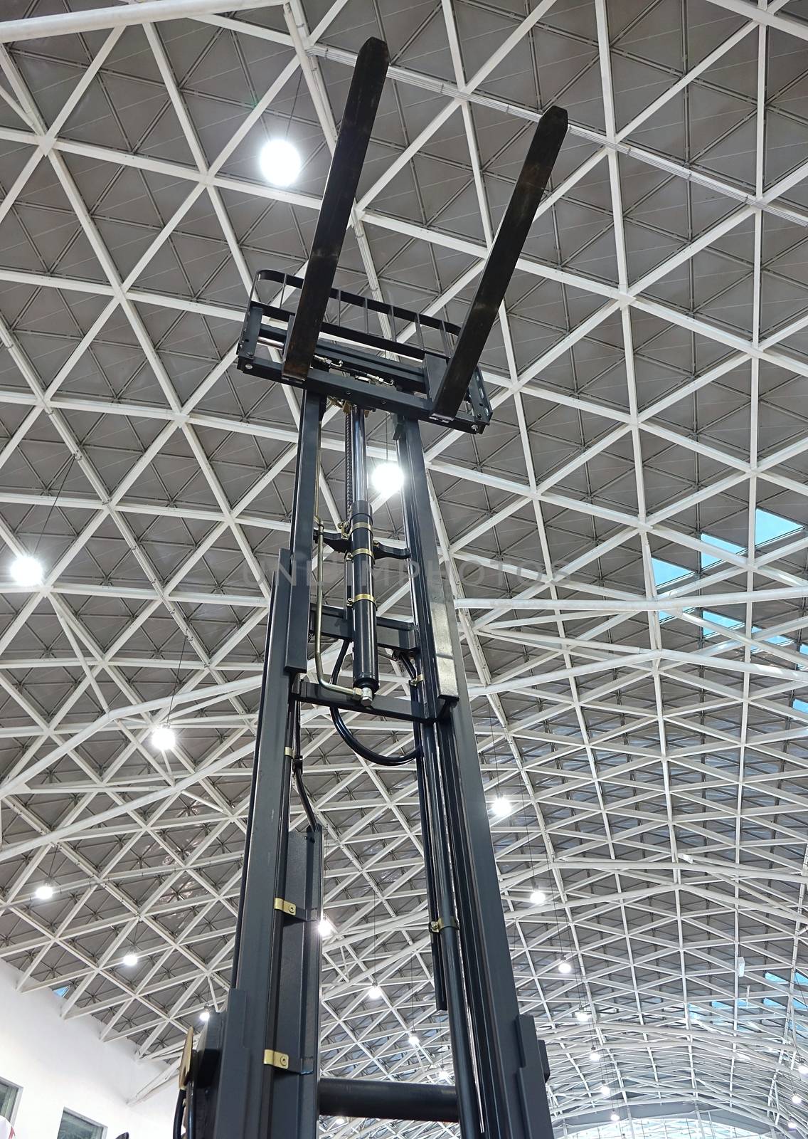 A large forklift truck with elevated blades