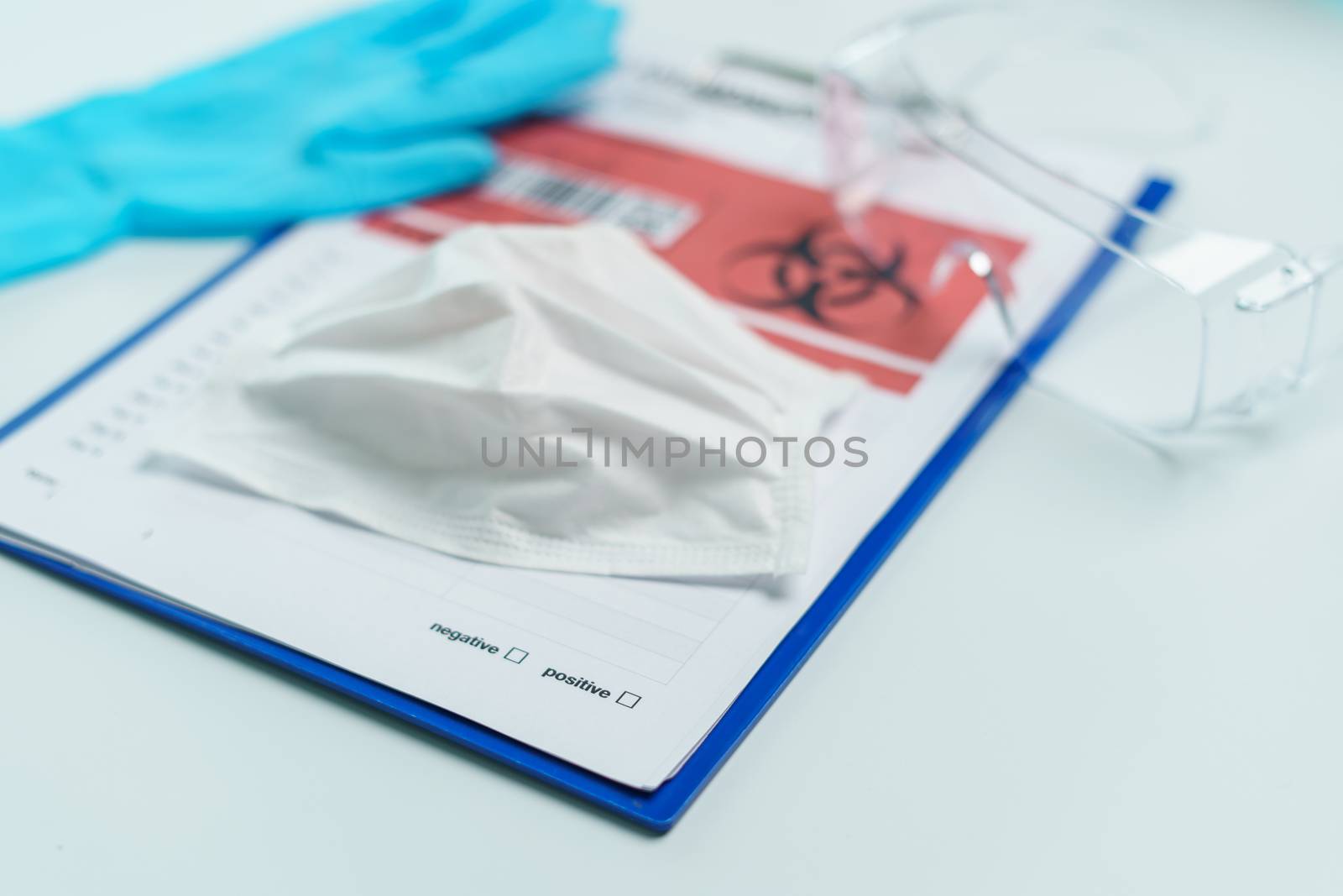Healthcare and medicine card of coronavirus disease on clipboard with personal protection equipment.