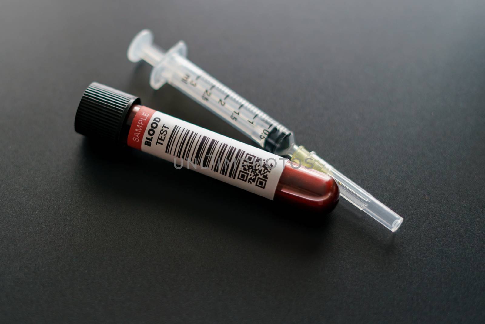 Coronavirus testing process, tube of blood test samples of coronavirus (COVID-19). (FAKE QR codes/barcodes)