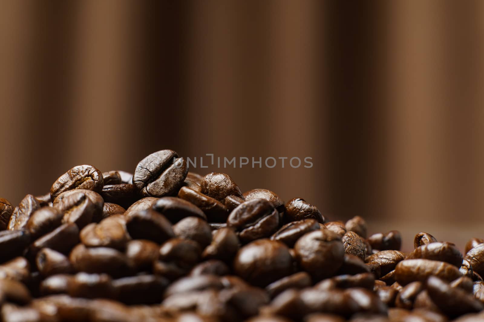 Roasted Coffee Beans texture on Curtain background, macro.