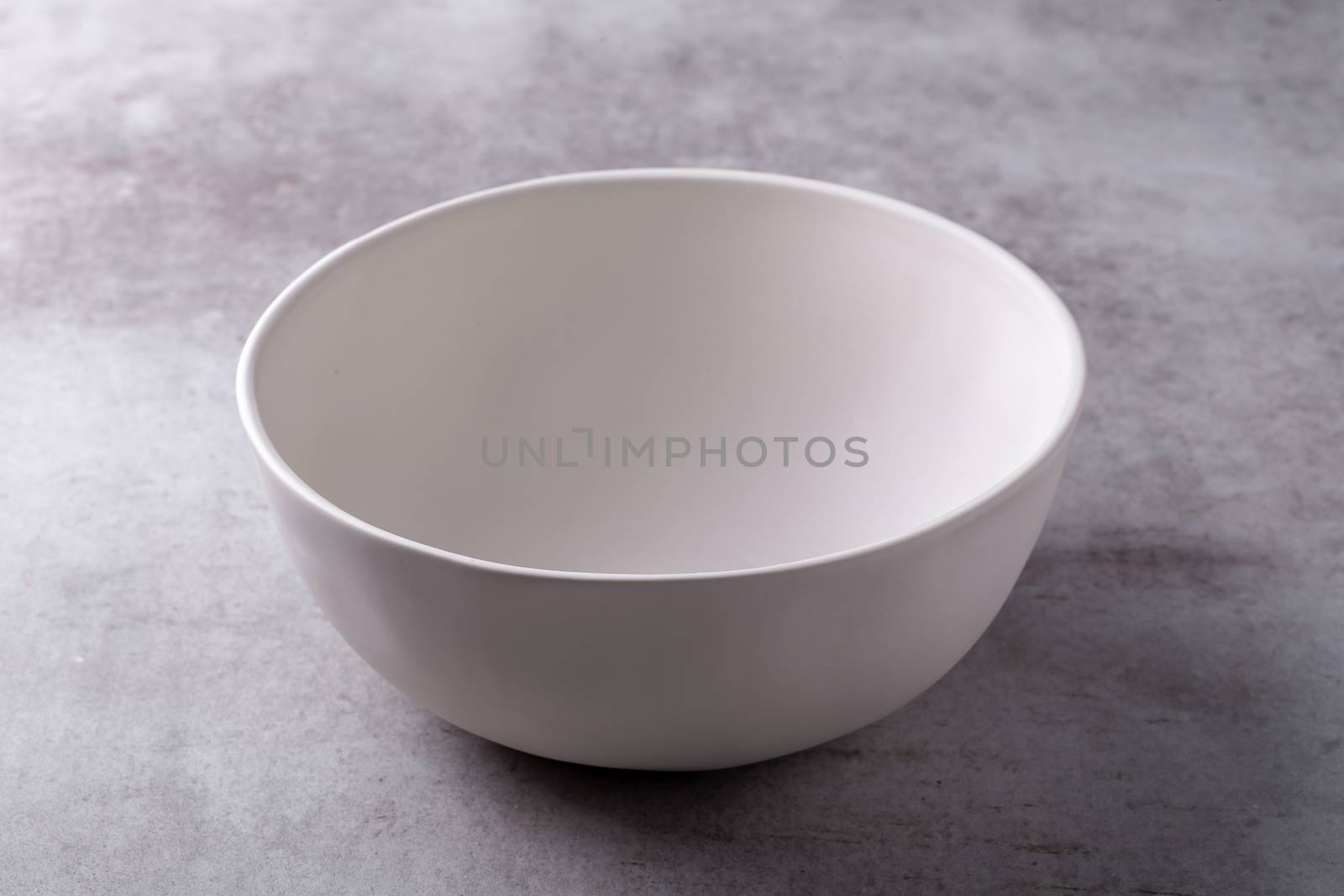 Empty blank white ceramic Bowl on Cement Board by kaiskynet