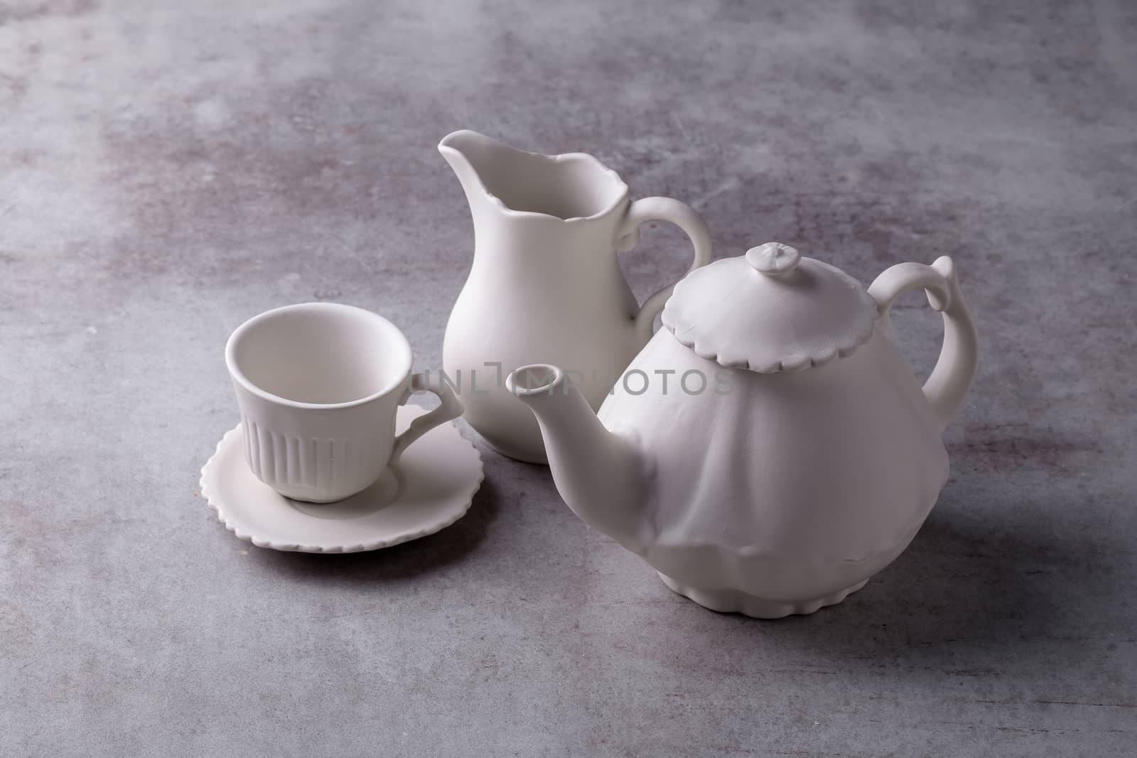 Teapot creamer, Cup and saucer on Cement Board by kaiskynet
