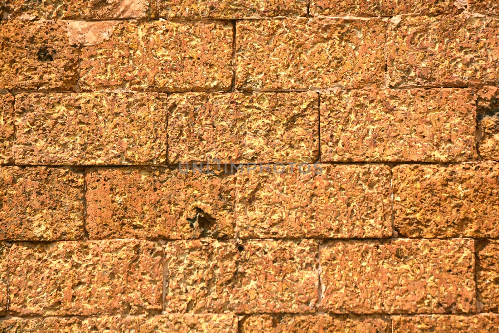 Weathered stained old brick wall background