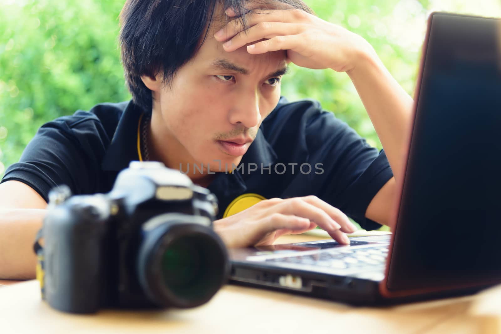 Photographer be nervous with job in notebook