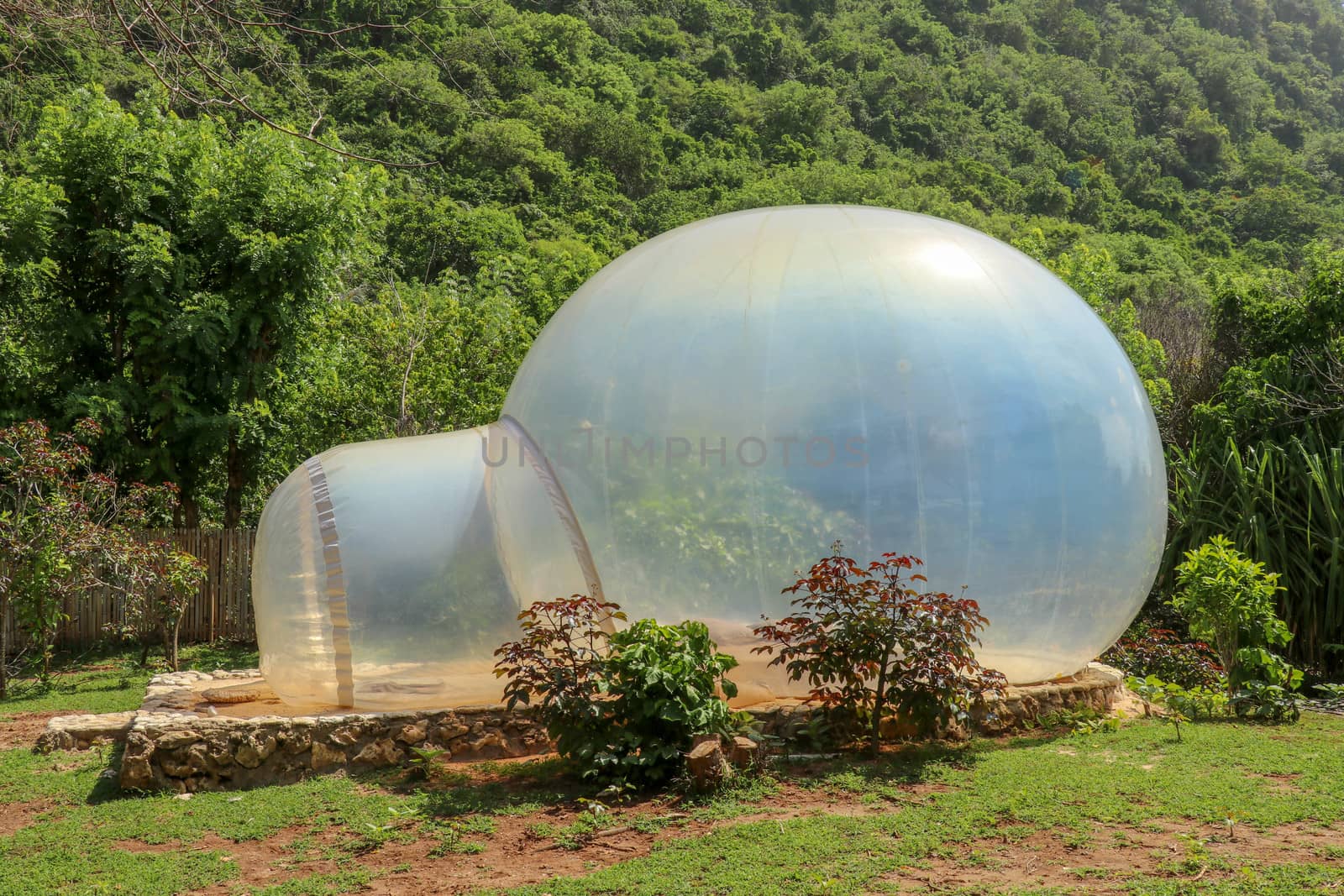 Romantic bubble house with transparent walls. Abstract sci-fi inflatable bubble. Atypical accommodation in exotic tourist destination. Tourist attraction in tropical paradise on Bali island, Indonesia