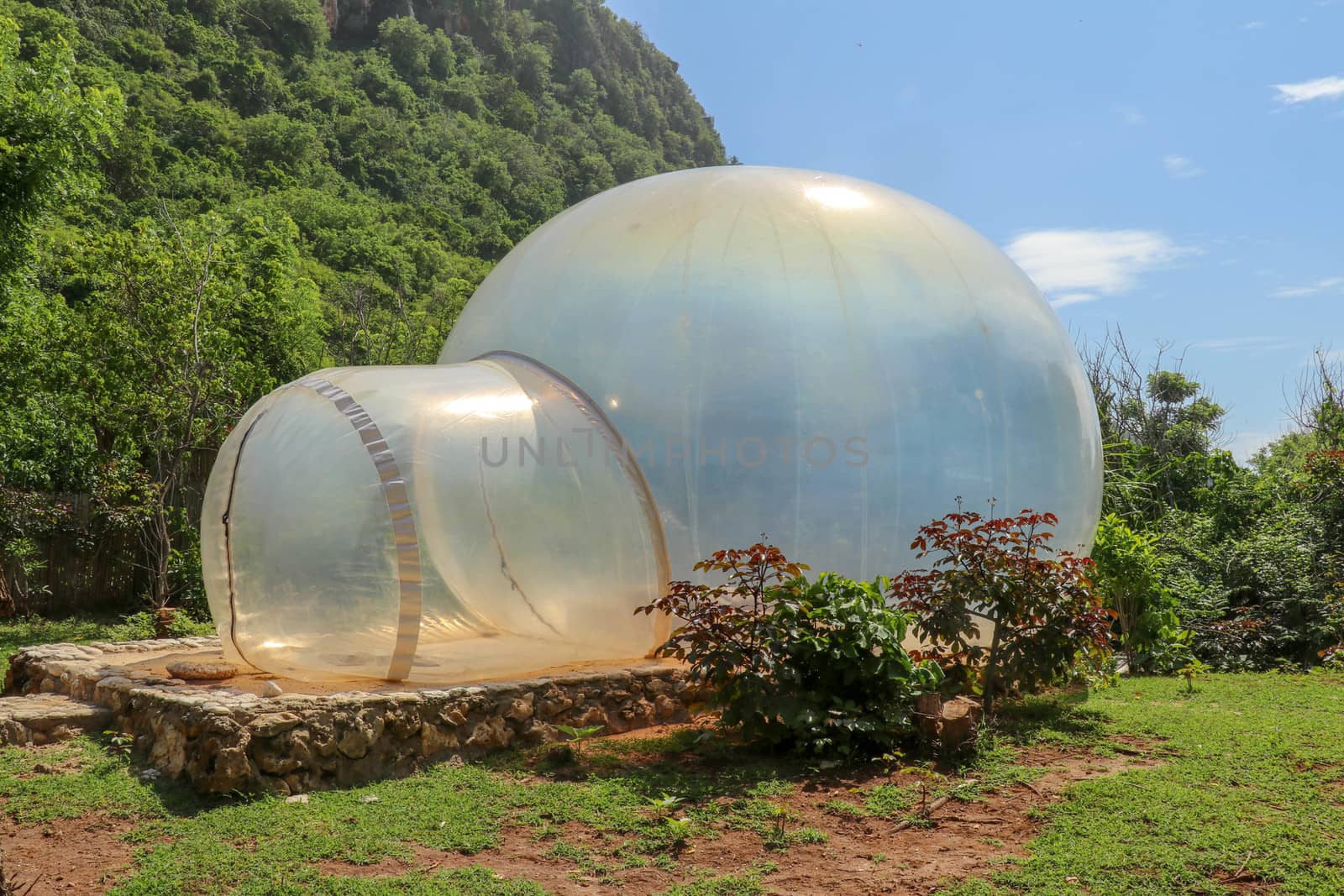 Romantic bubble house with transparent walls. Abstract sci-fi inflatable bubble. Atypical accommodation in exotic tourist destination. Tourist attraction in tropical paradise on Bali island, Indonesia