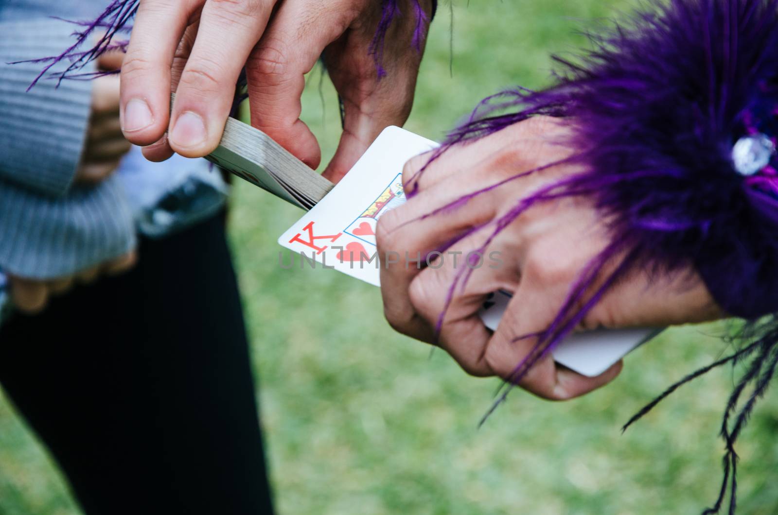 Joker with a king of hearts in his hand ready for the game