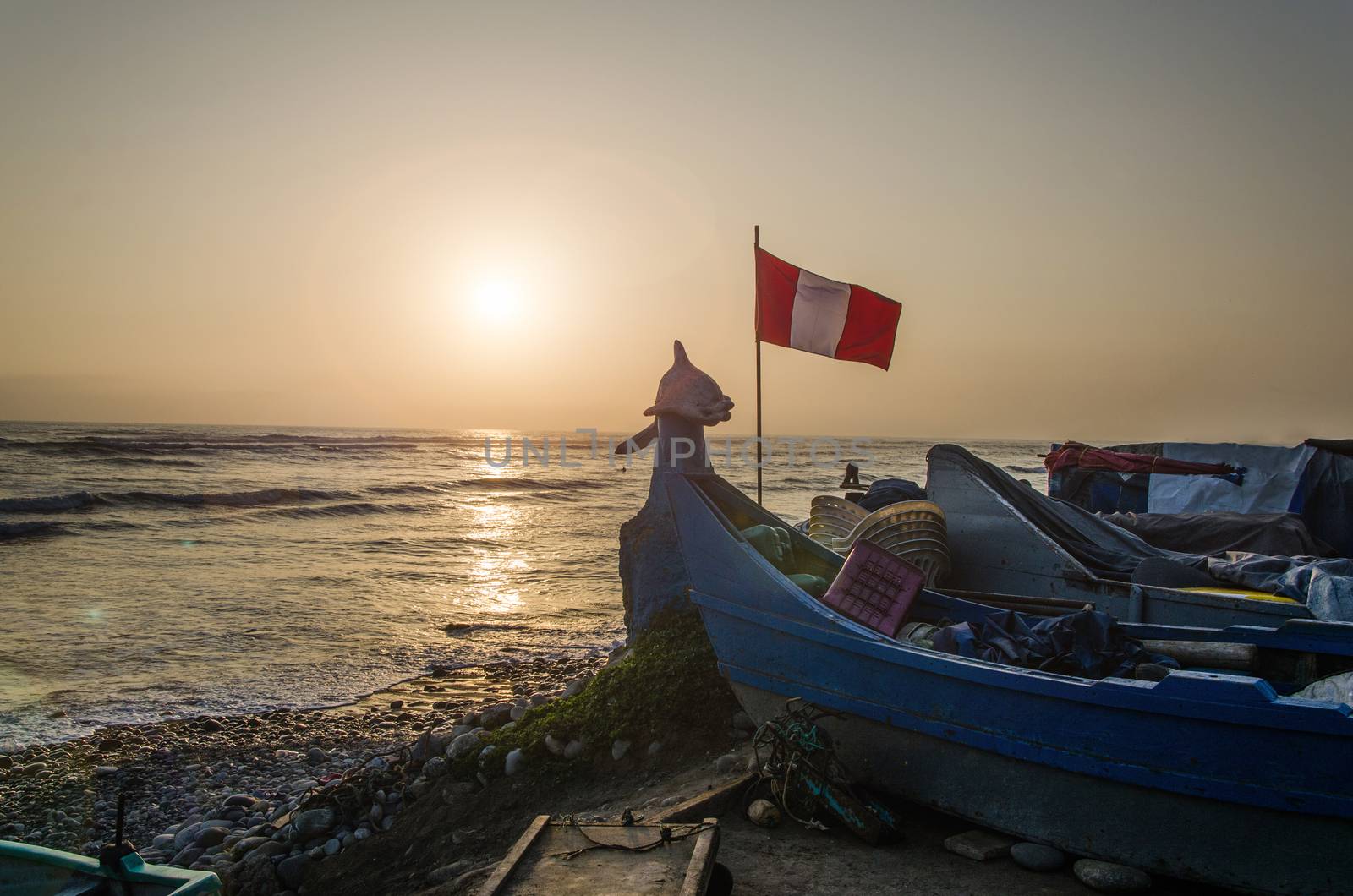 Boat with the flag of Peru on the beach Pescadores in Chorrillos, Lima - Peru