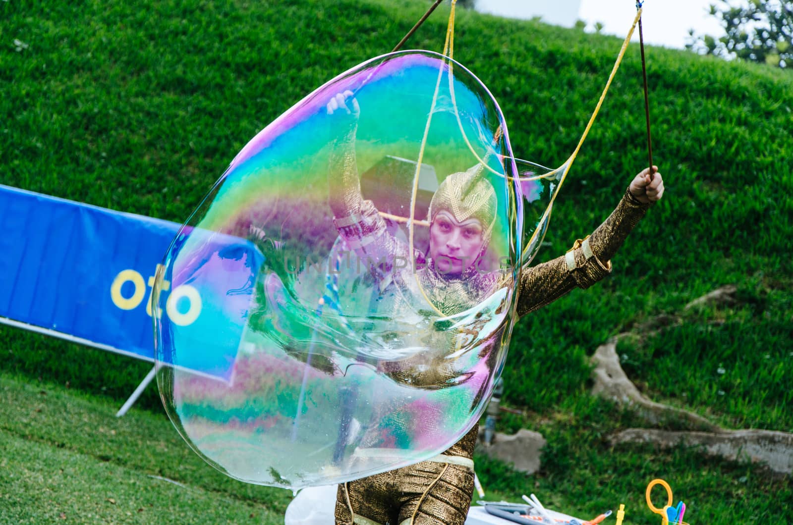 Man in disguise making a big bubble