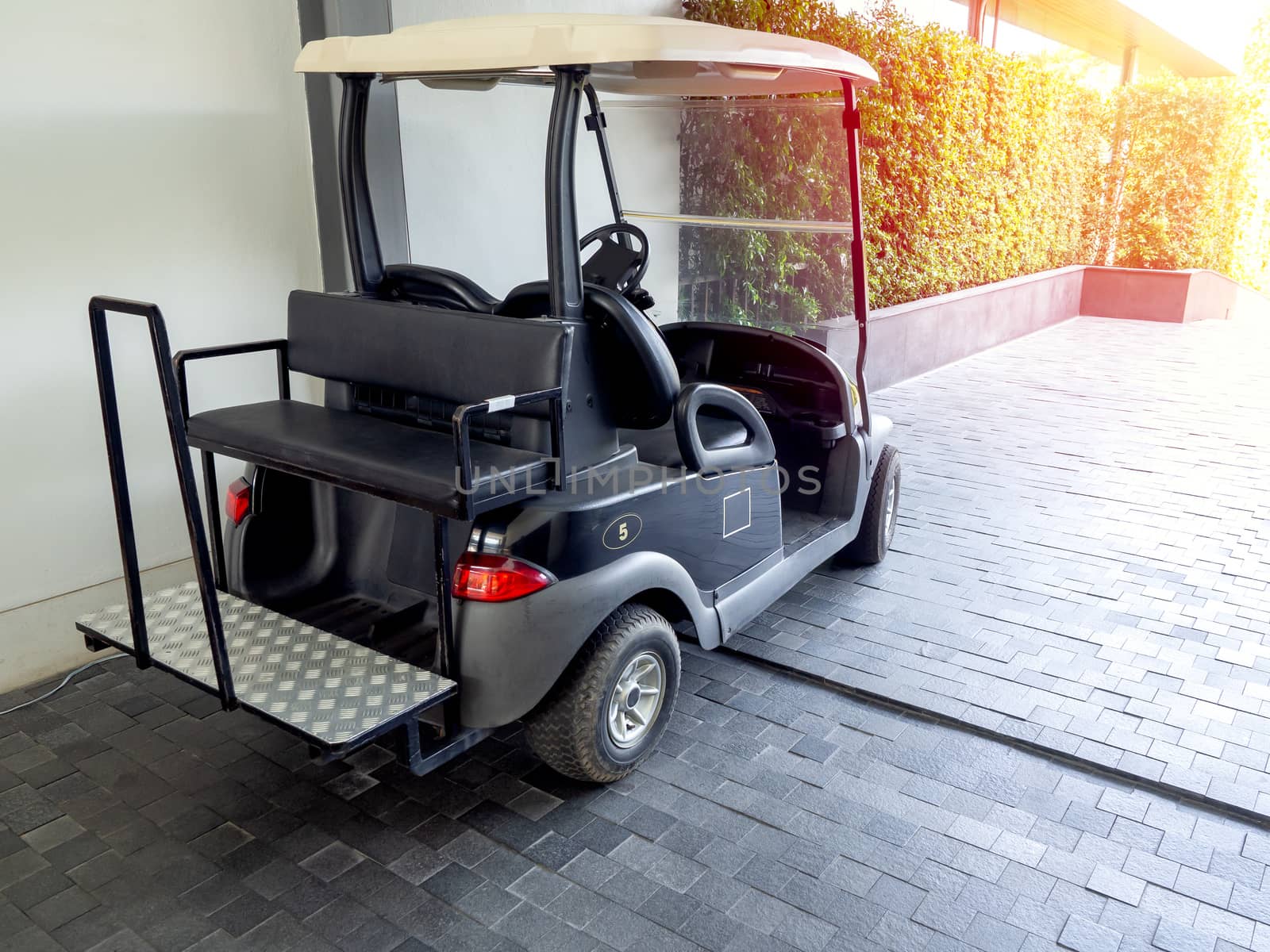 Black golf cart or golf buggy car in the hotel. by tete_escape