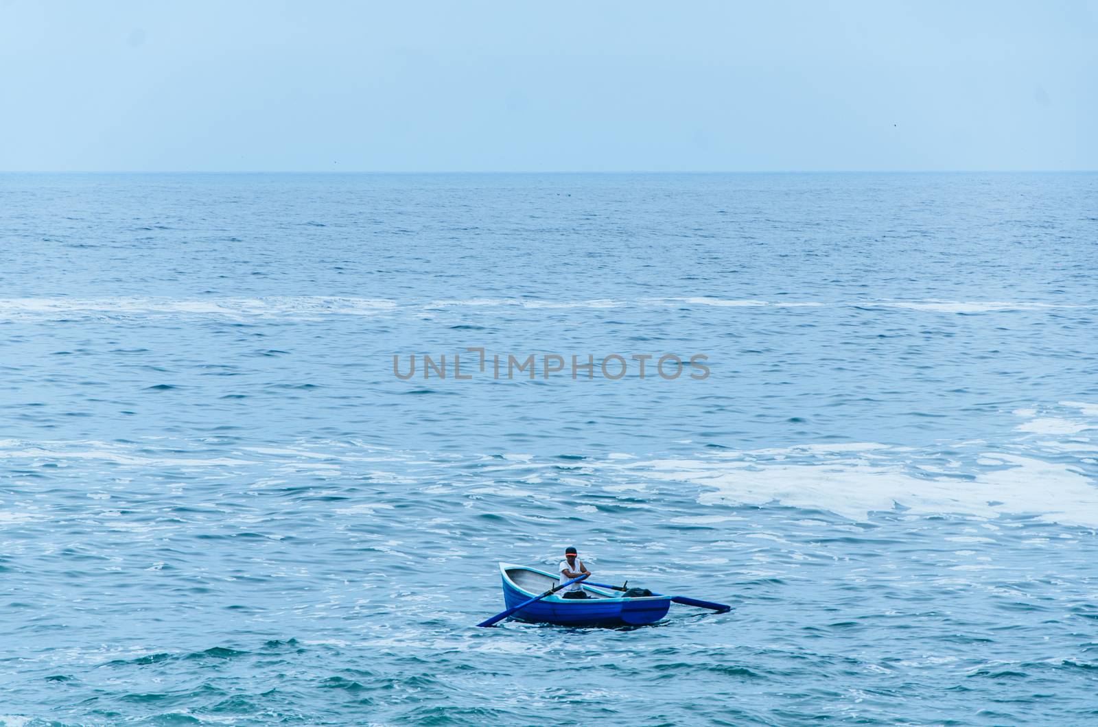 Boatman sailing on the beaches of Lima - Peru