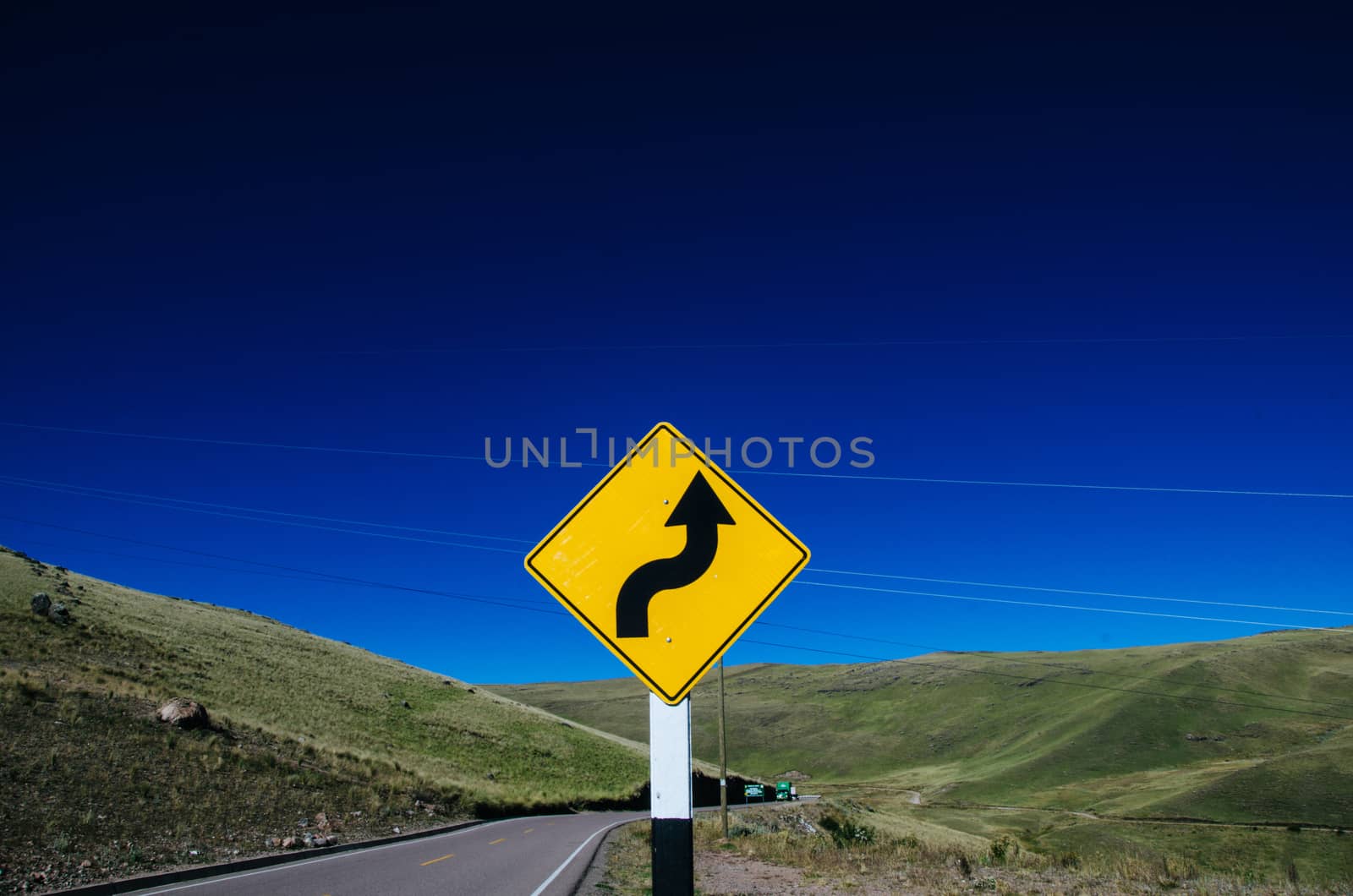 Curve sign on a highway on the way to Ayacucho - Peru