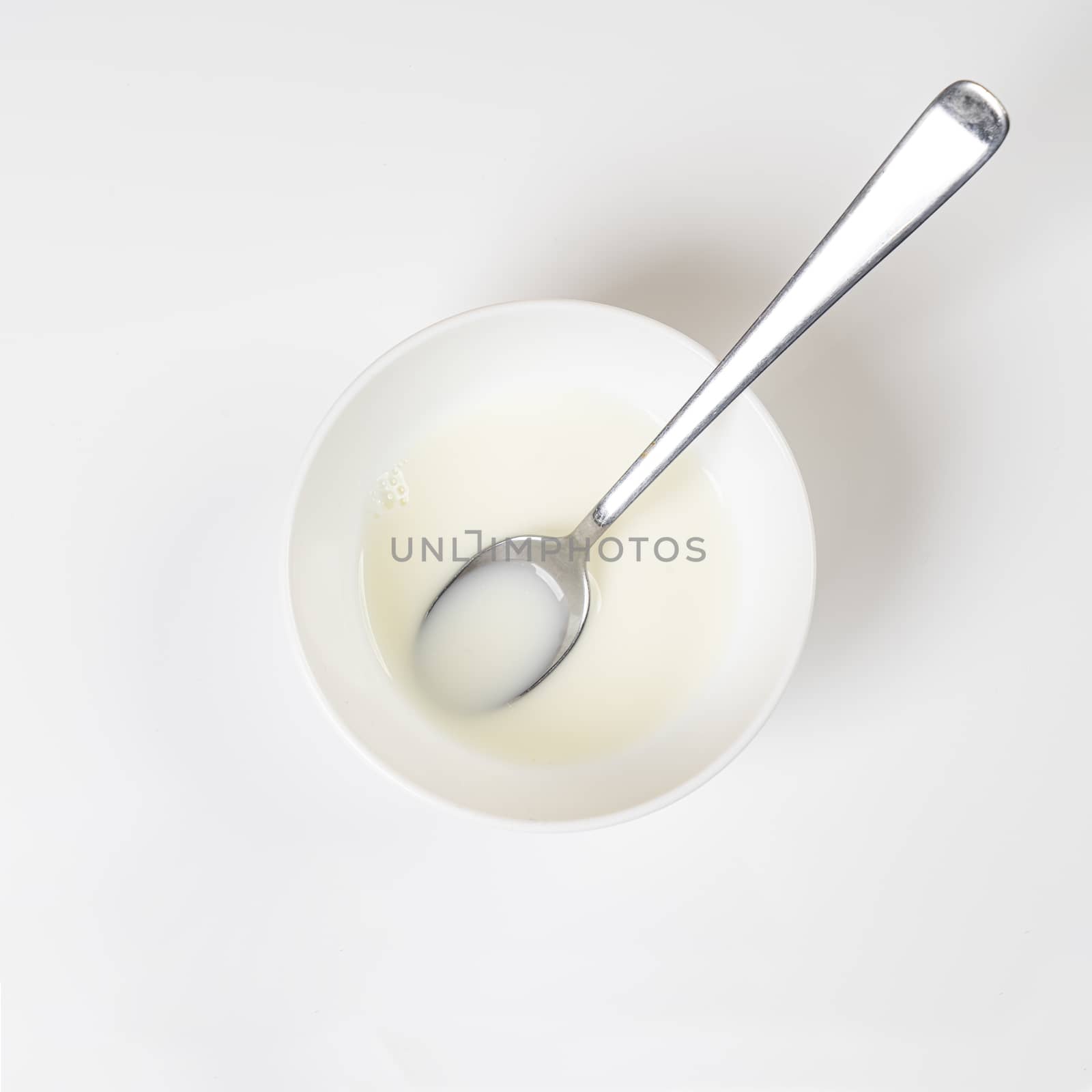 a white cup of milk isolated