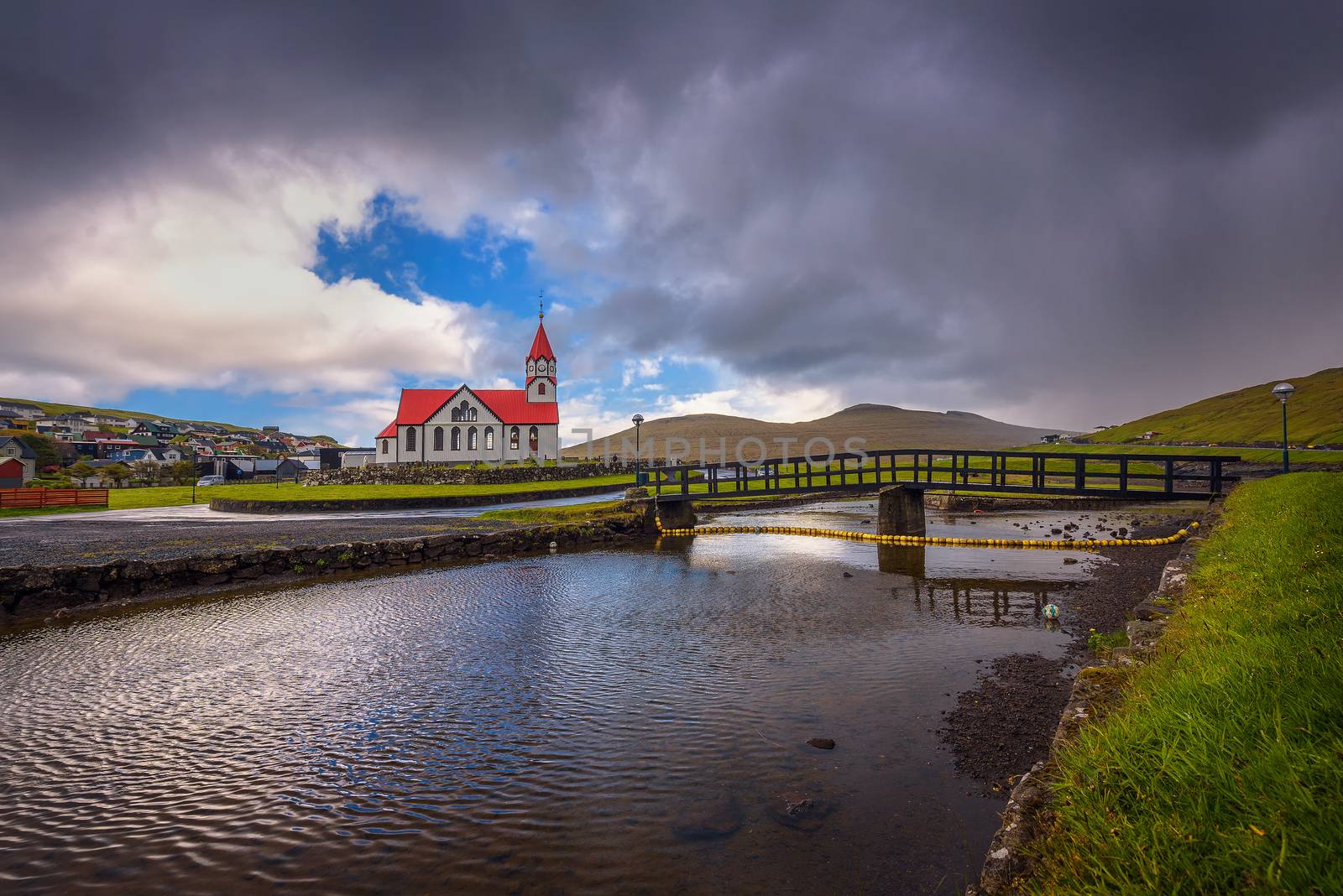 Church and the river Stora located in Sandavagur on Faroe Islands, Denmark by nickfox