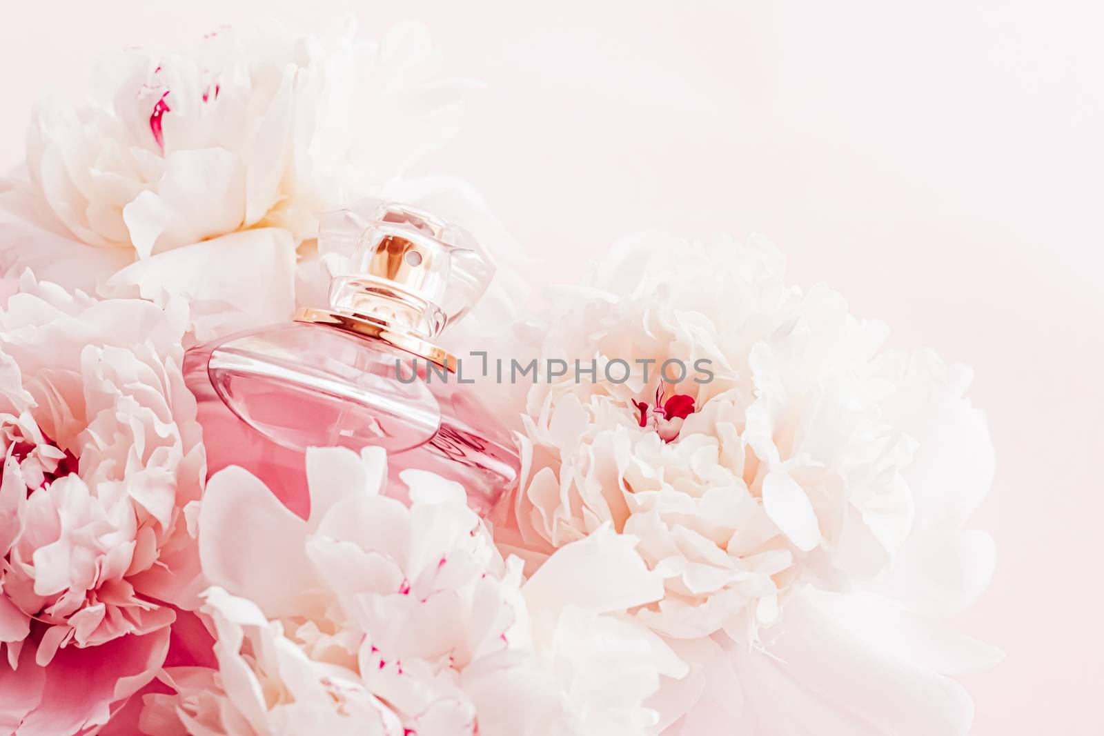 Luxe fragrance bottle as girly perfume product on background of peony flowers, parfum ad and beauty branding by Anneleven