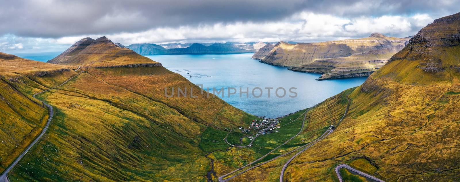 Aerial panorama of mountains around village of Funningur on Faroe Islands by nickfox