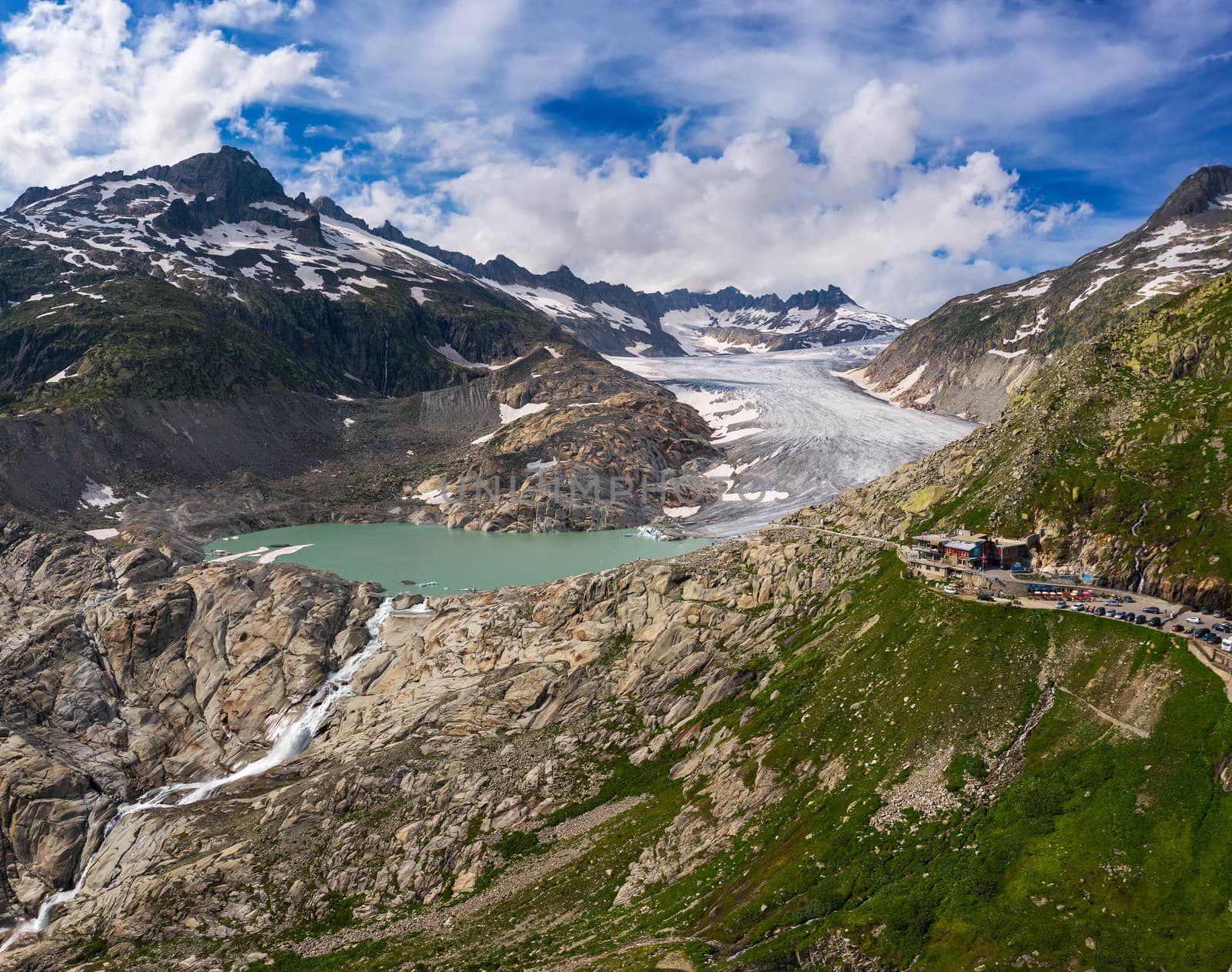 Aerial view of the melting Rhone glacier and the glacial lake in the Swiss Alps by nickfox