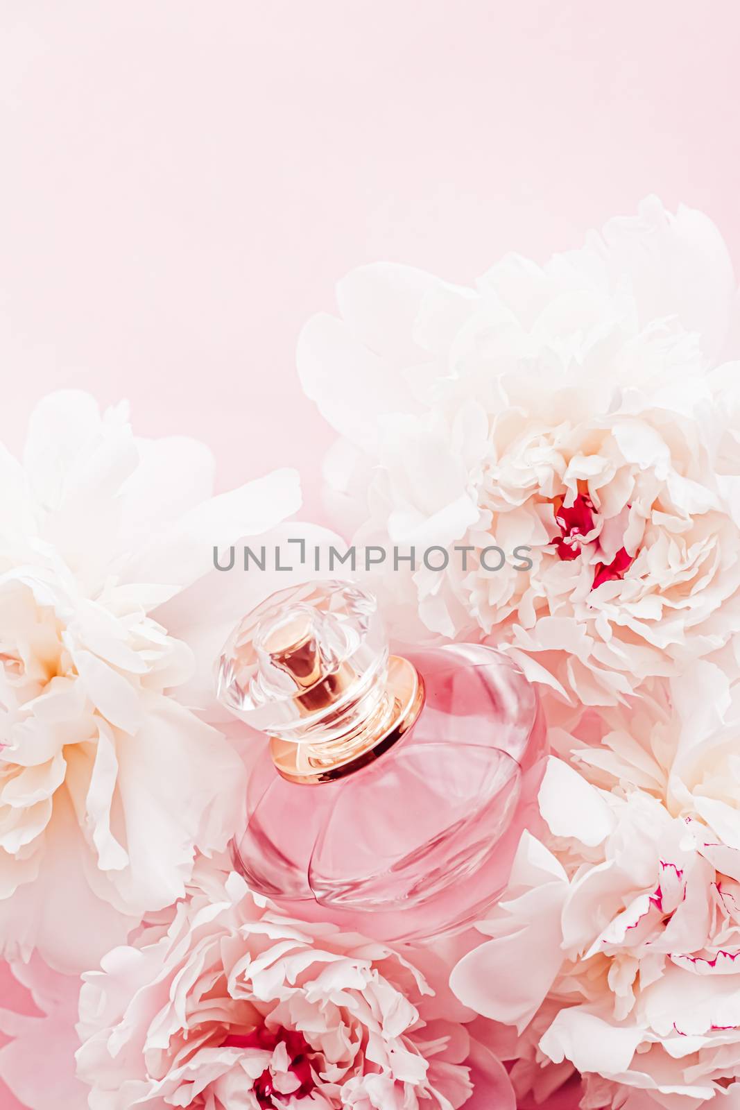 Luxe fragrance bottle as girly perfume product on background of peony flowers, parfum ad and beauty branding by Anneleven