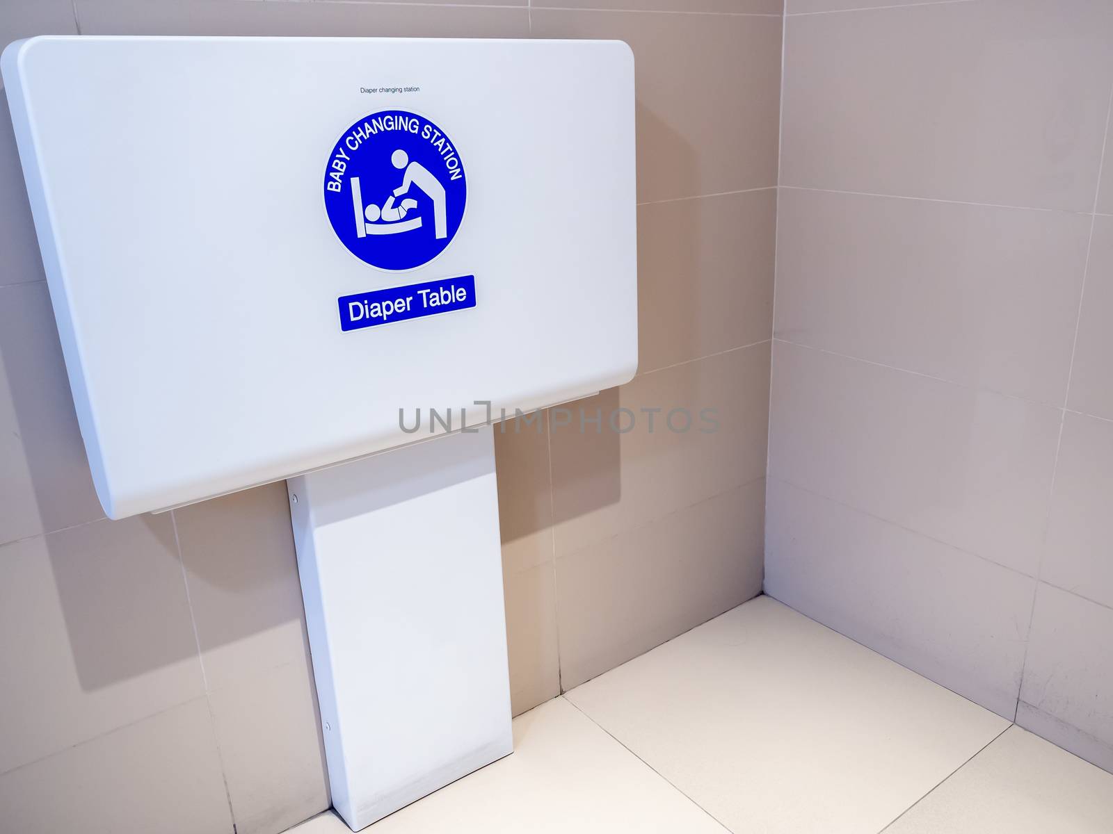 White diaper table changing station on the wall for baby changing diaper to facilitate to children parents in the airport.