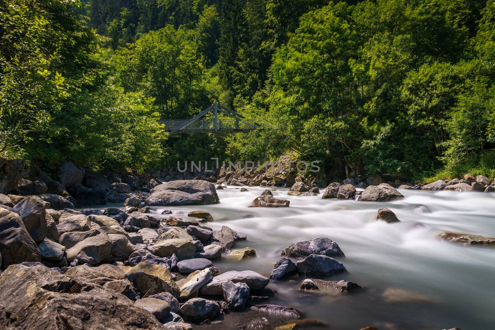 Kander river flowing near Blausee lake in the Bernese Oberland, Switzerland by nickfox