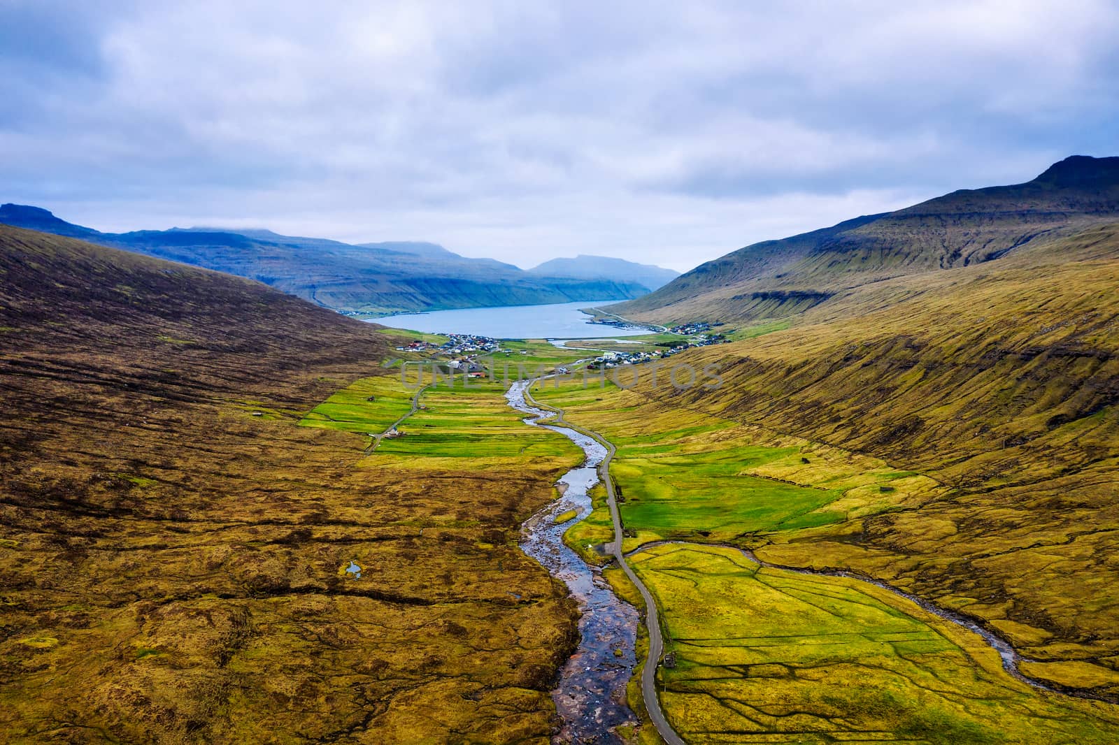 Aerial view of a road going from Streymnes to the village of Saksun along the Stora River on Faroe Islands.