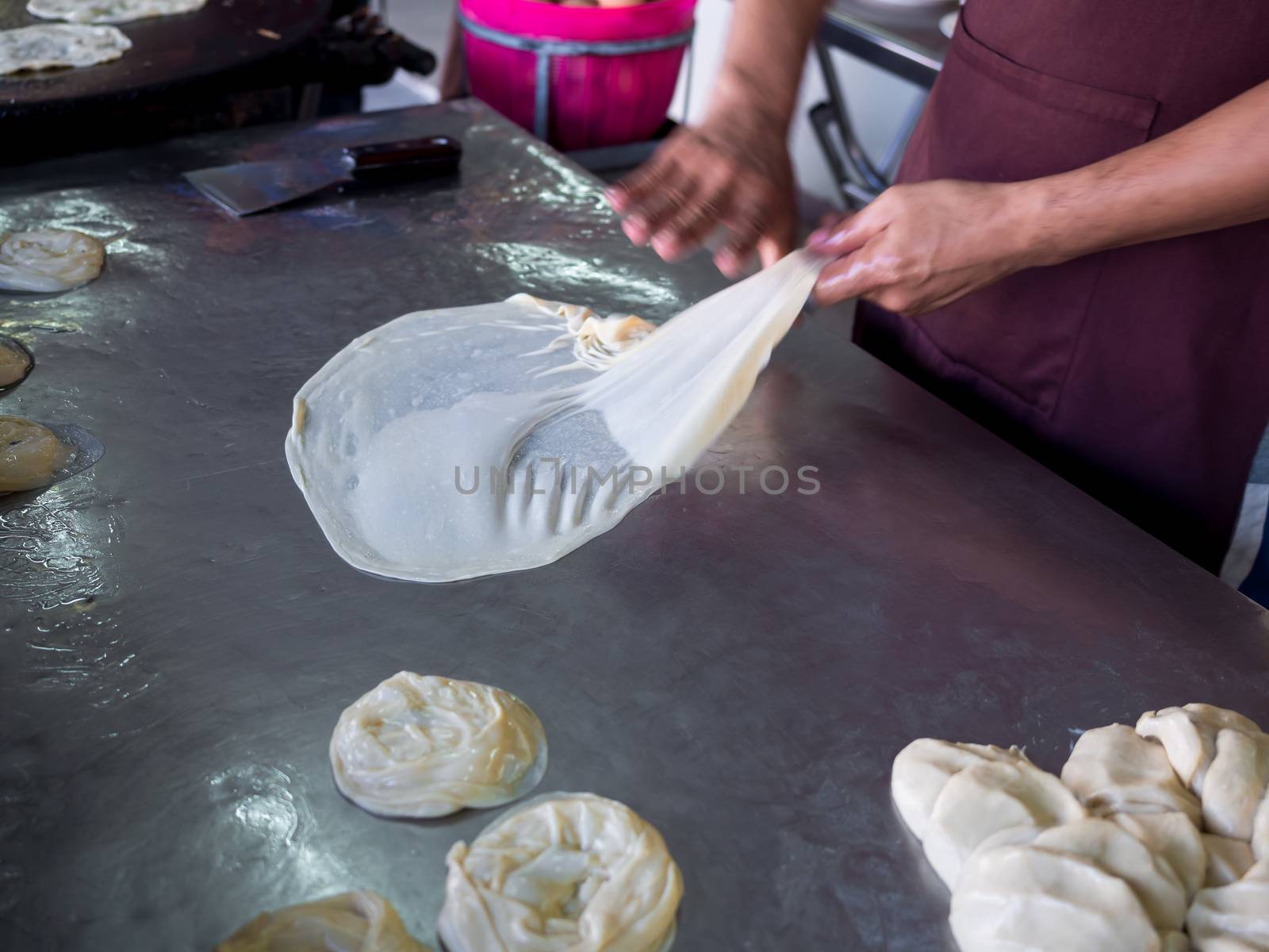 Roti Making, roti thresh flour by roti maker with oil. Indian tr by tete_escape