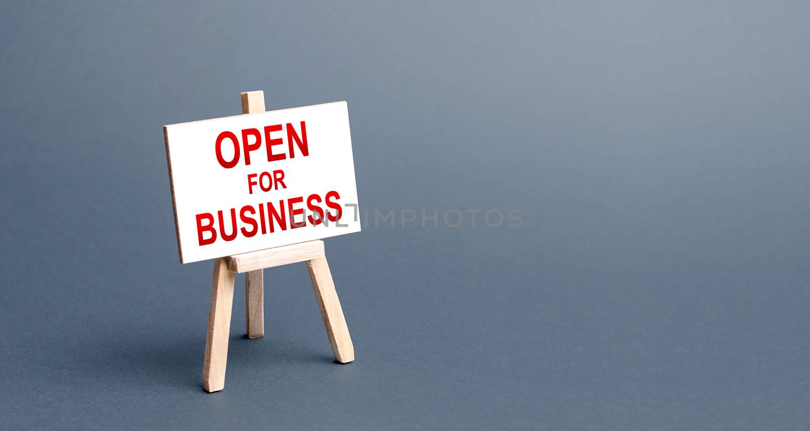 Open for business easel sign. Opening a business of establishments, resuming economic life after a long closure. Economy recovery from the crisis. Financial support, preferential cheap loans. by iLixe48