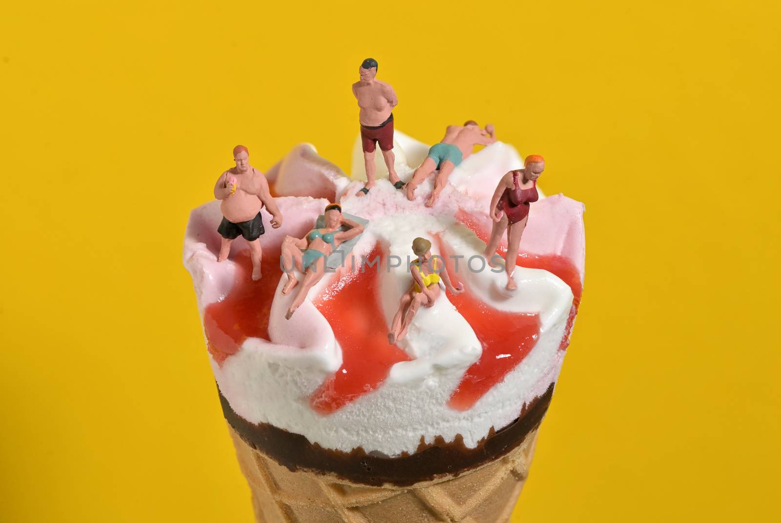 Ice Cream In Waffle Cone and Miniature People on Beach