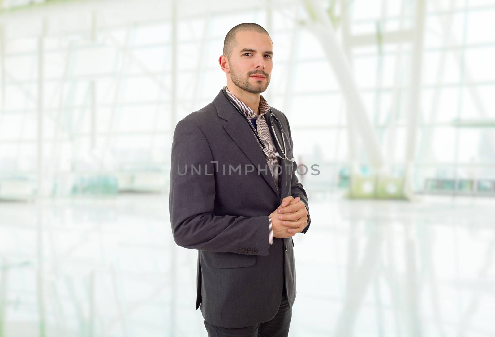 happy male doctor, at the office