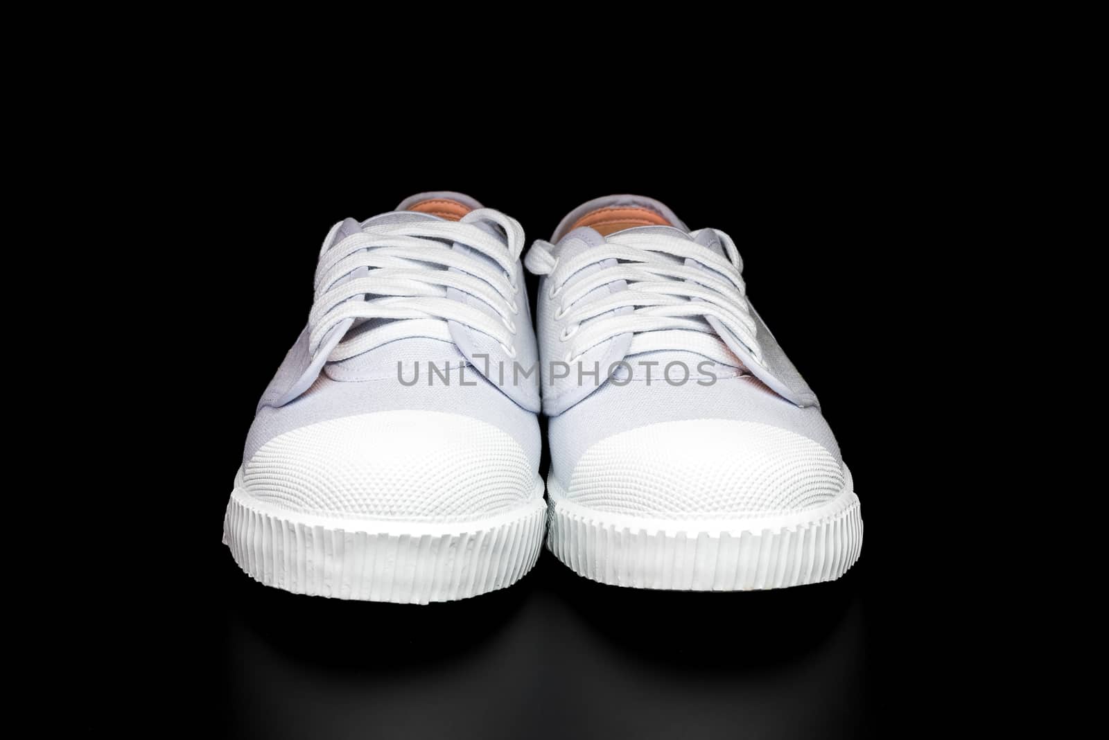 White Sneakers isolated on black background