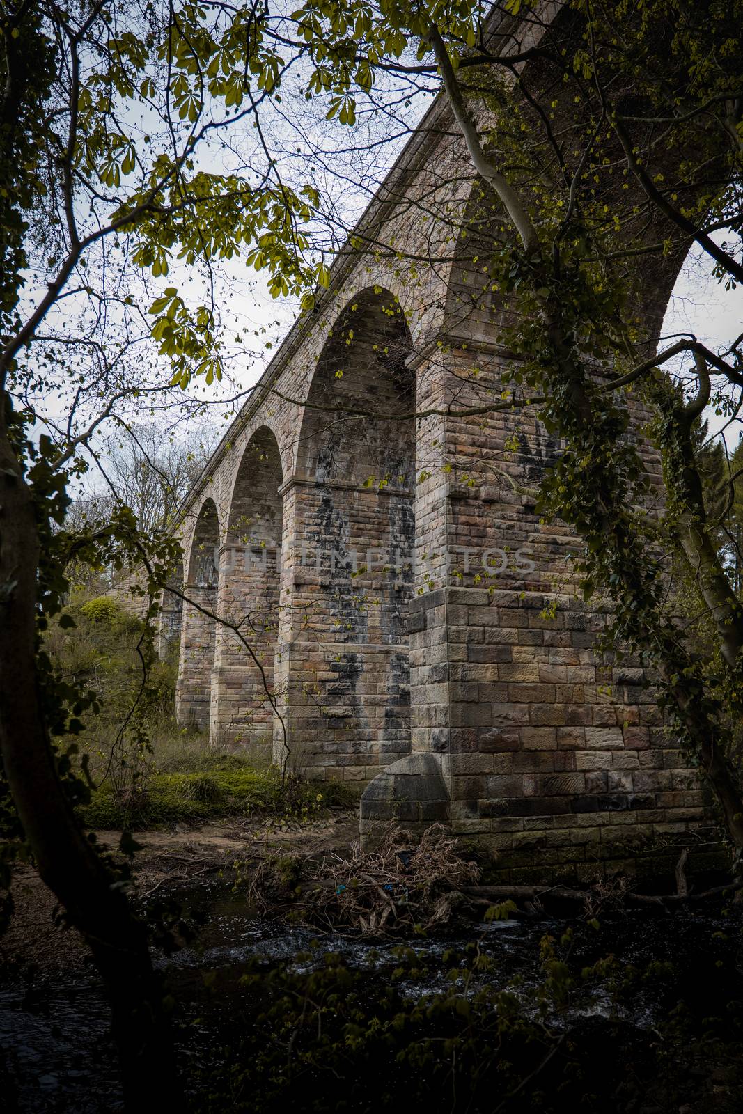 An old stone built British viaduct in the Yorkshire countryside
