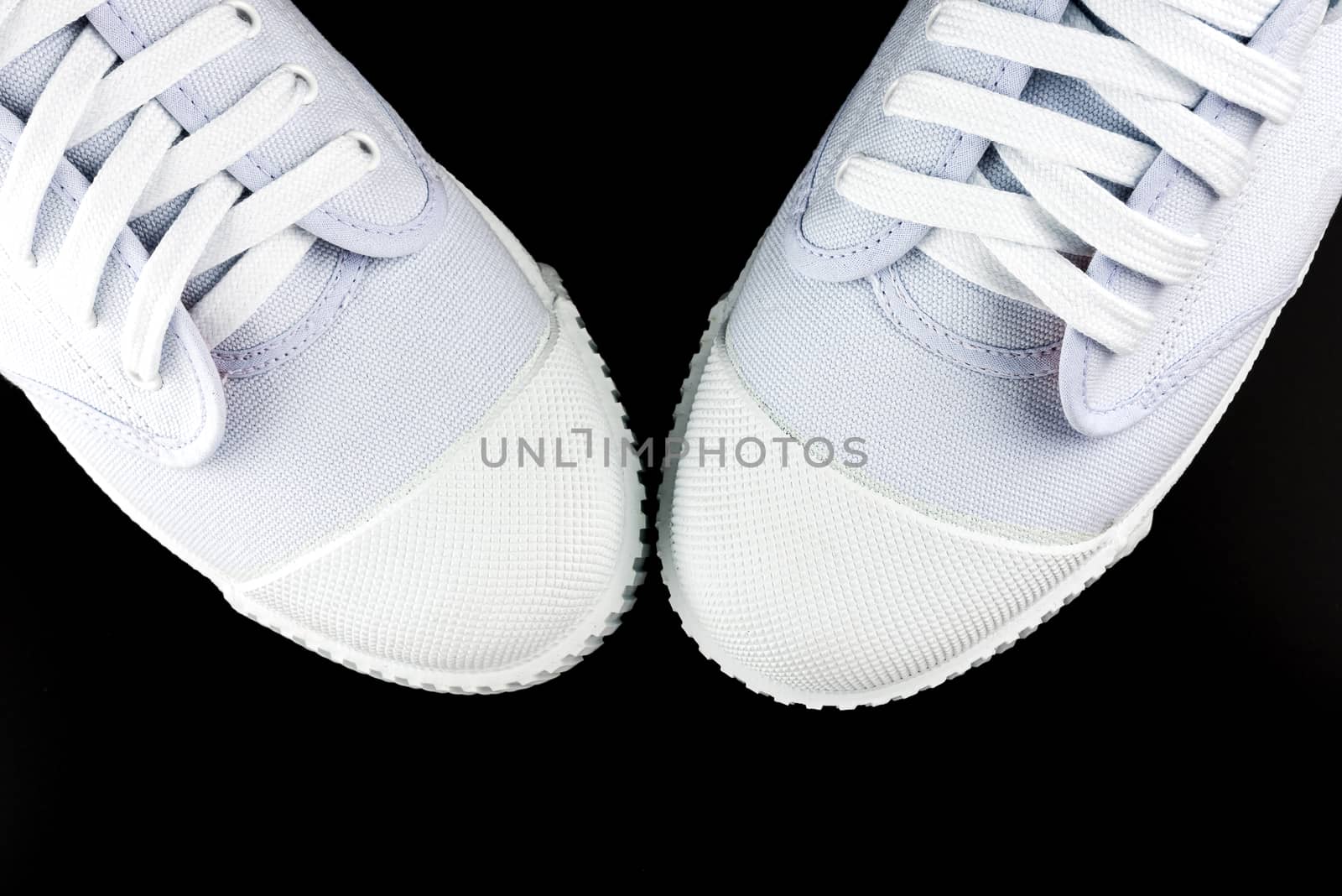 Top View White Sneakers isolated on black background