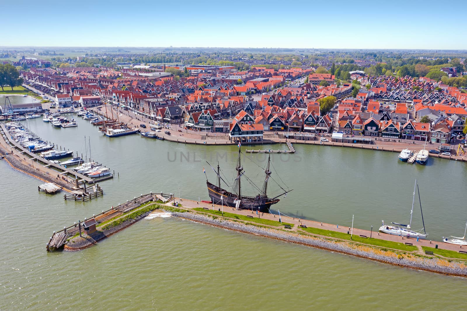 Aerial from the harbor and traditional village Volendam in the N by devy