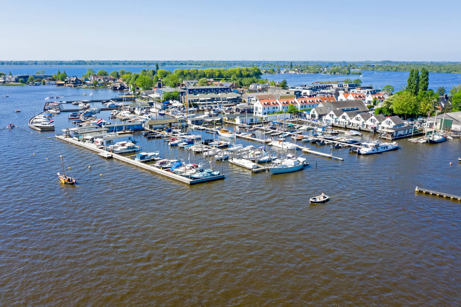 Aerial from the harbor at the Loosdrechtse Plassen in the Netherlands on a beautiful summer day