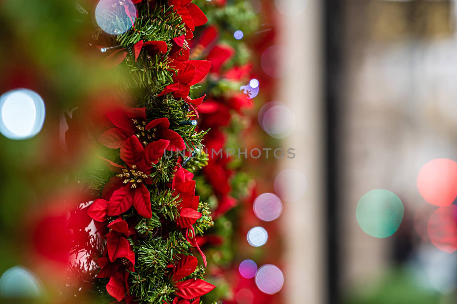 Christmas lights and decorations on the facade of the building, Selective focus, defocused Christmas background 