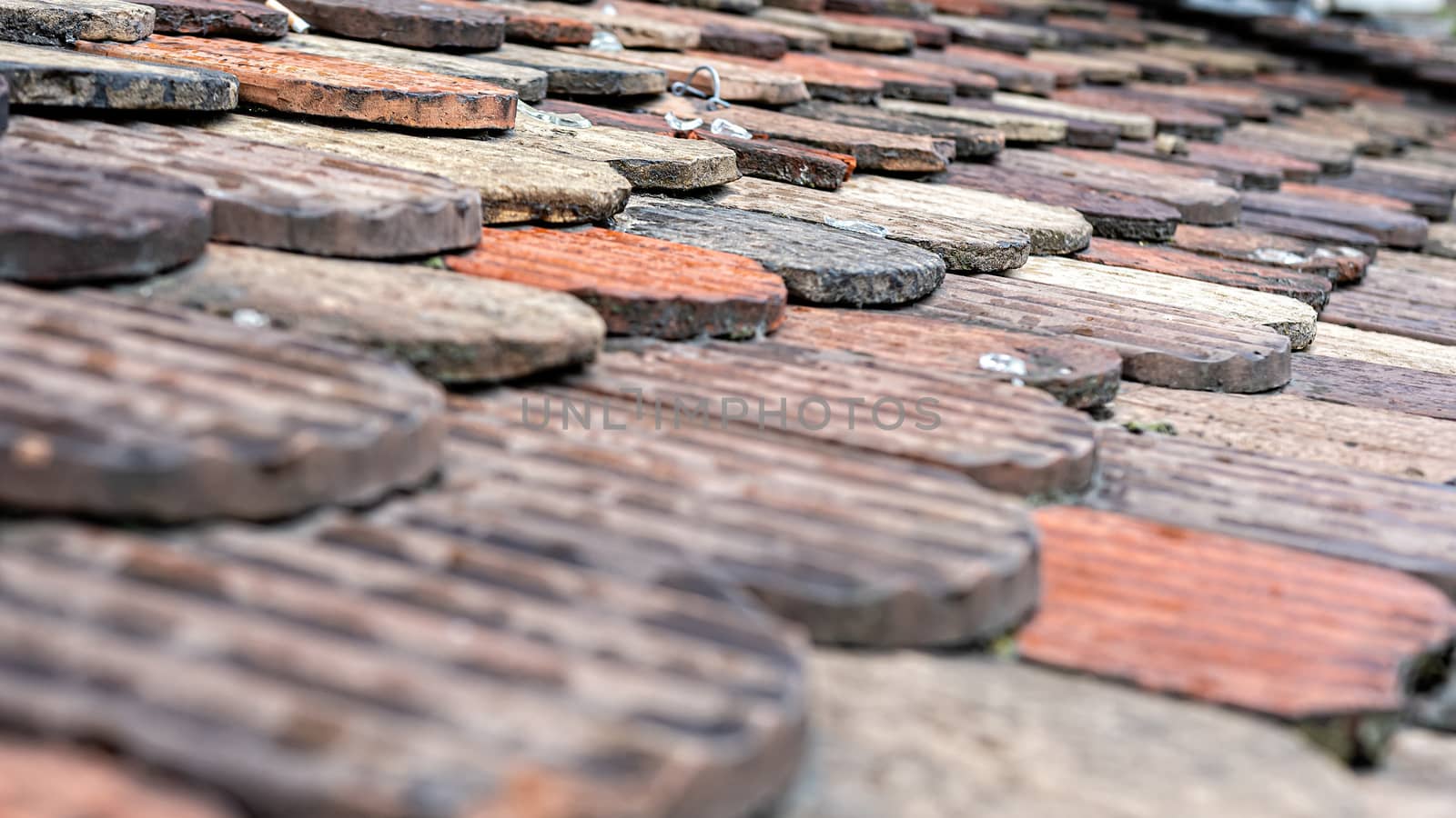 ceramic roof tiles on an old roof, selective focus, Geneva, Switzerland - image