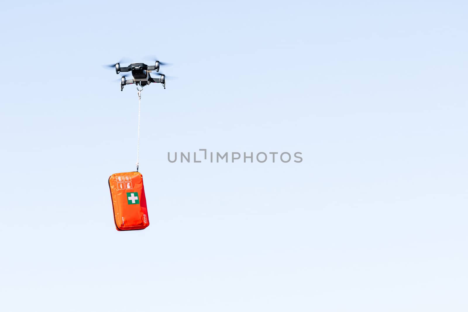 drone delivers a first aid kit with coronavirus medication, concept for delivery of COVID-19 virus medication using modern technology