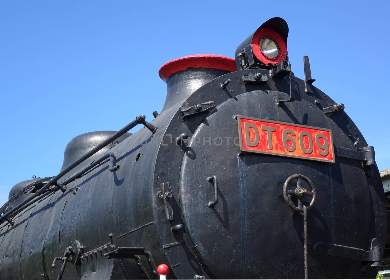 Frontal view of a vintage steam locomotive