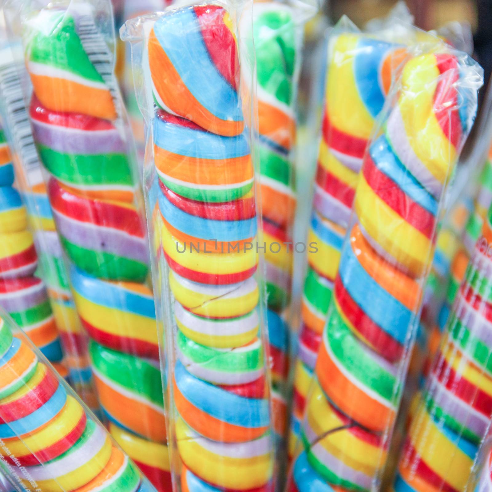 Many colorful candies in store color bright background lollipop