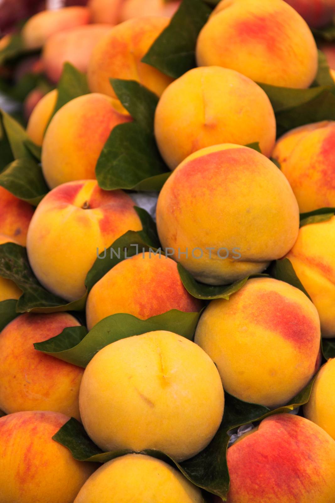 Fresh peach fruits at market by destillat